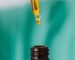 brown glass bottle with liquid and pipette
